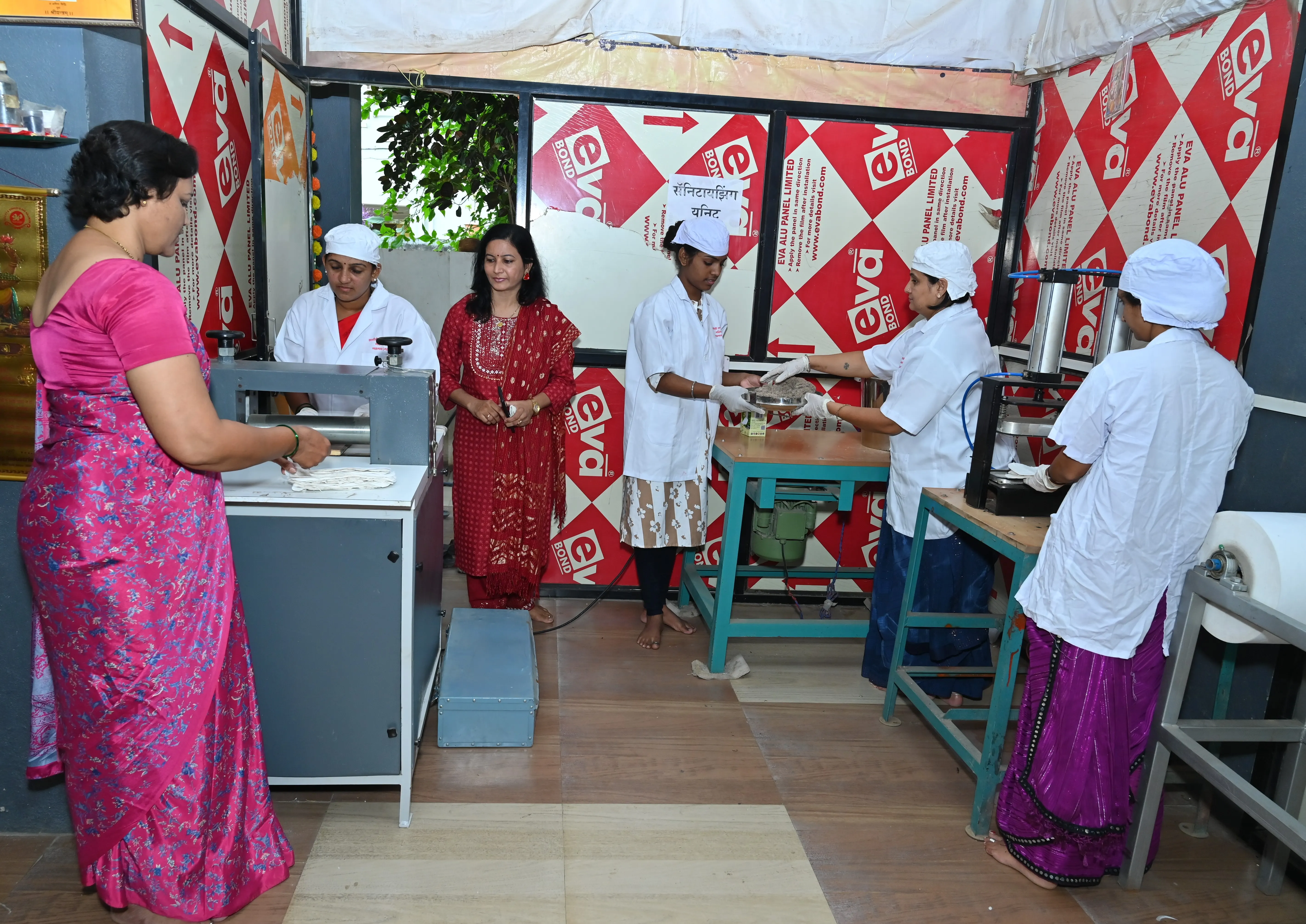 Women and Hapeefive team members standing together at a community event